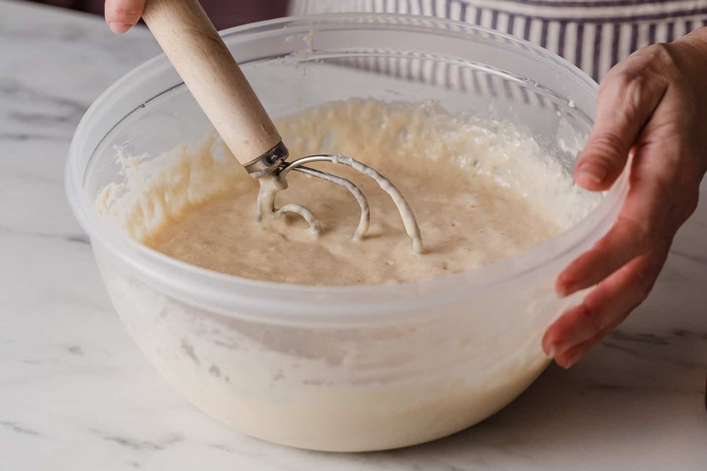 Mixing batter with a whisk.