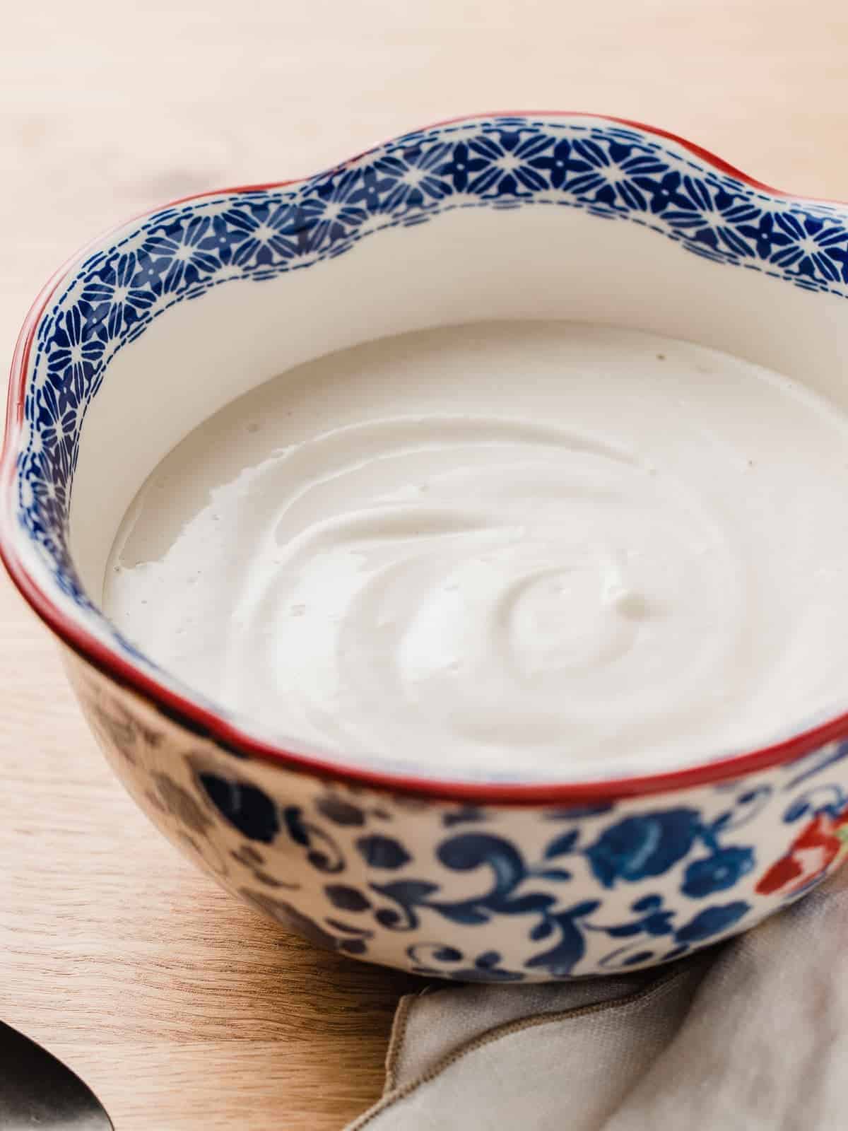Cashew cream sauce in a bowl on a table.