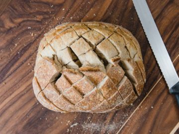 Sourdough bread cut with a grid pattern.