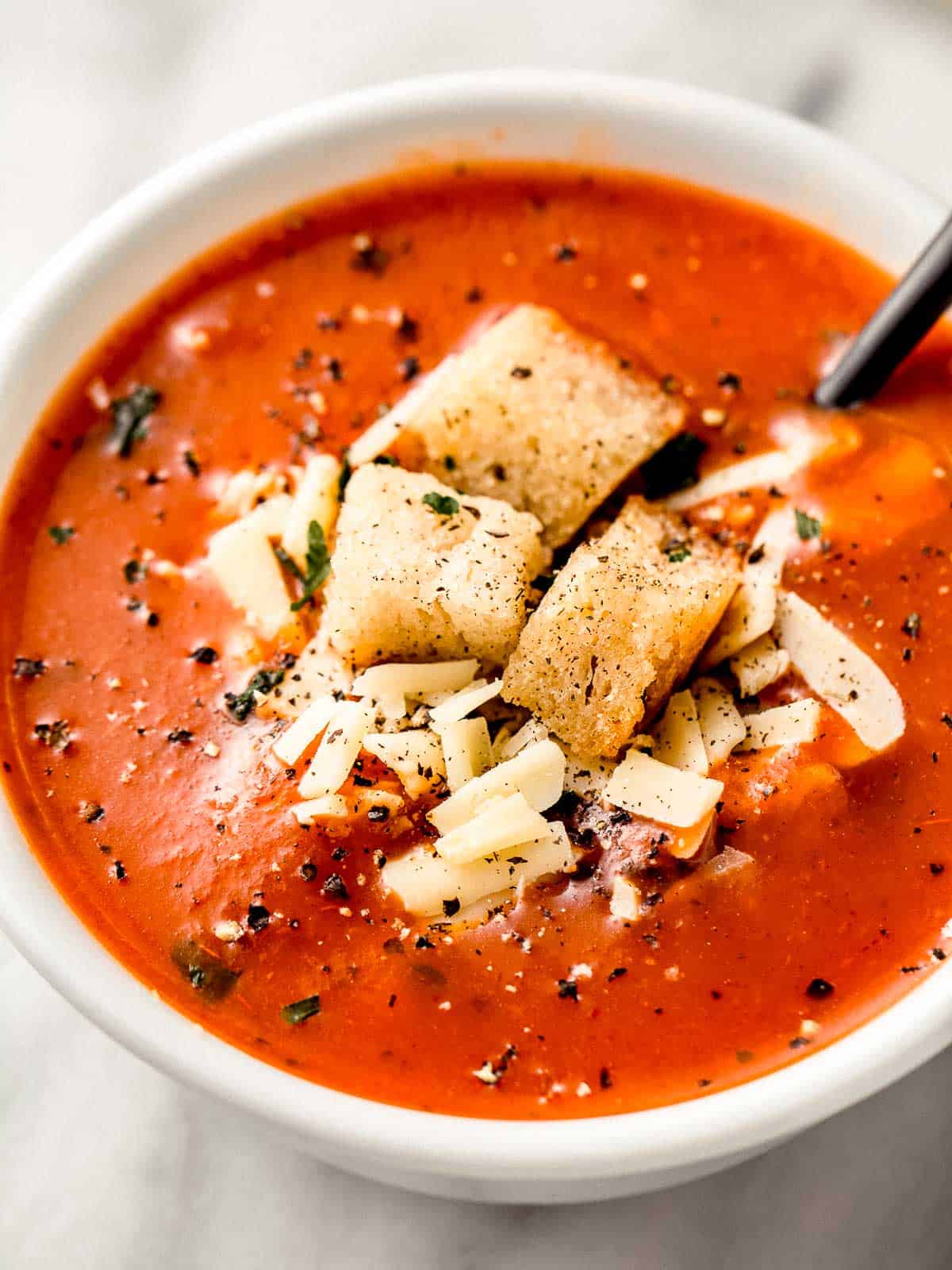 Homemade tomato soup in a bowl with croutons.
