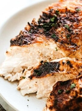 A slice of juicy chicken breast on a plate.