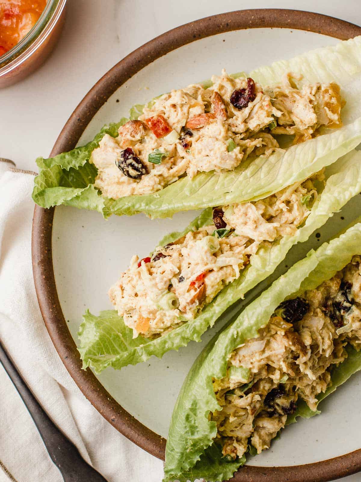 Curried chicken salad with mango chutney in lettuce wraps.