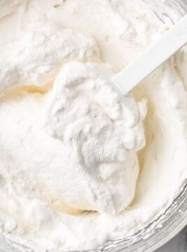 Top view of homemade whipped cream in a bowl.