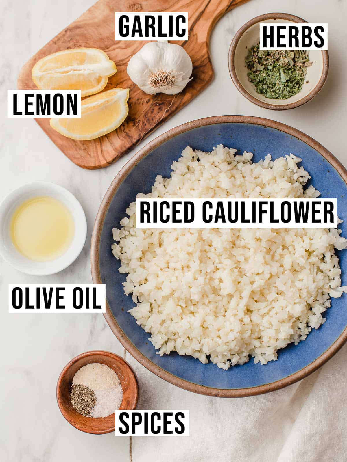 Greek cauliflower rice ingredients on a table.