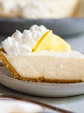 A slice of no-bake lemon icebox pie on a plate.