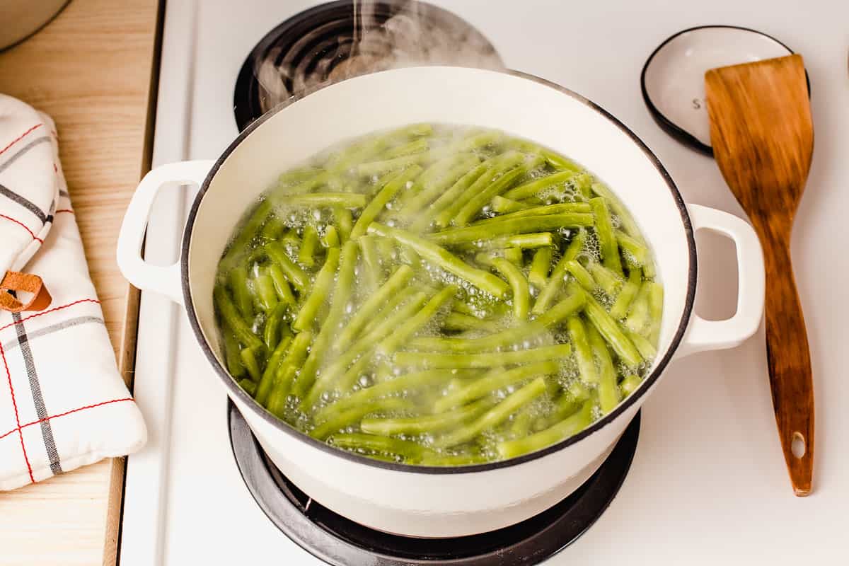 Green beans boiling on the stovetop.