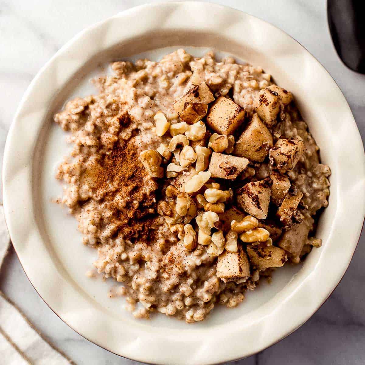 Slow cooker apple oatmeal in a bowl.