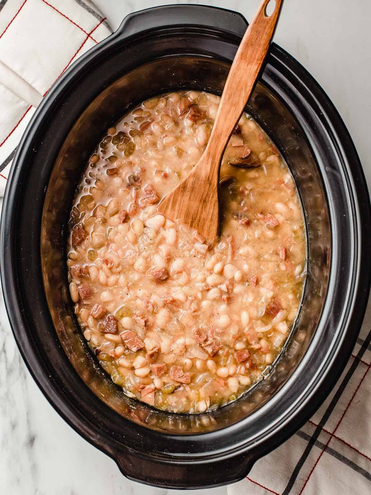 Slow cooker white beans and ham finished in the pot.