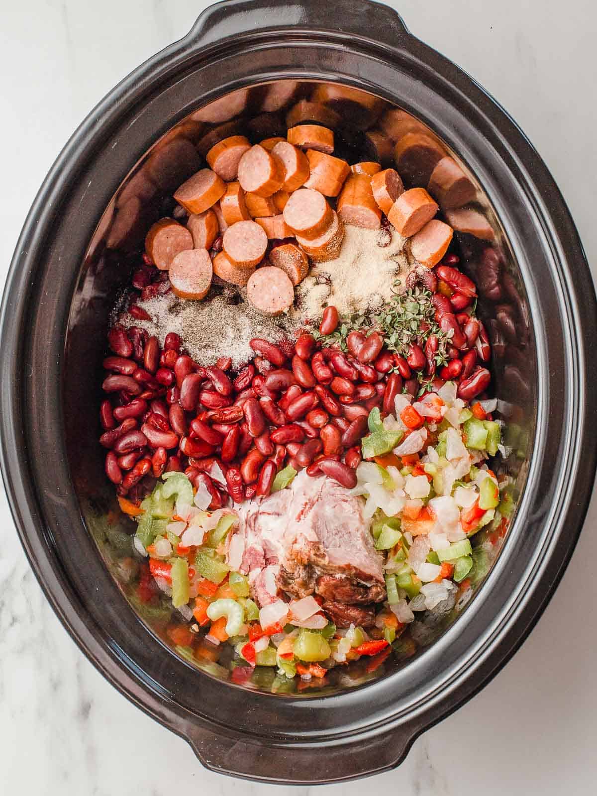 Red beans and rice ingredients in the slow cooker.