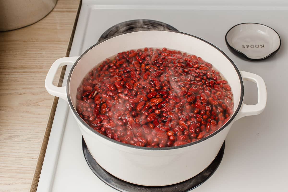 Red beans boiling on stovetop.