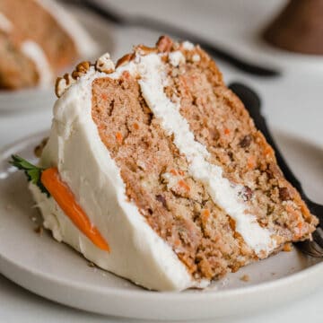 Carrot cake slice on a plate.