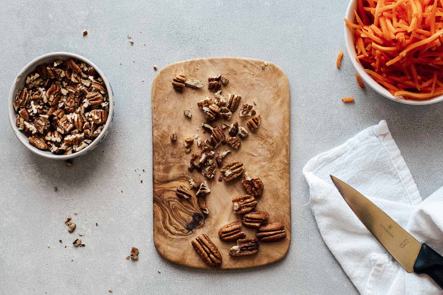 Pecans on a cutting board.