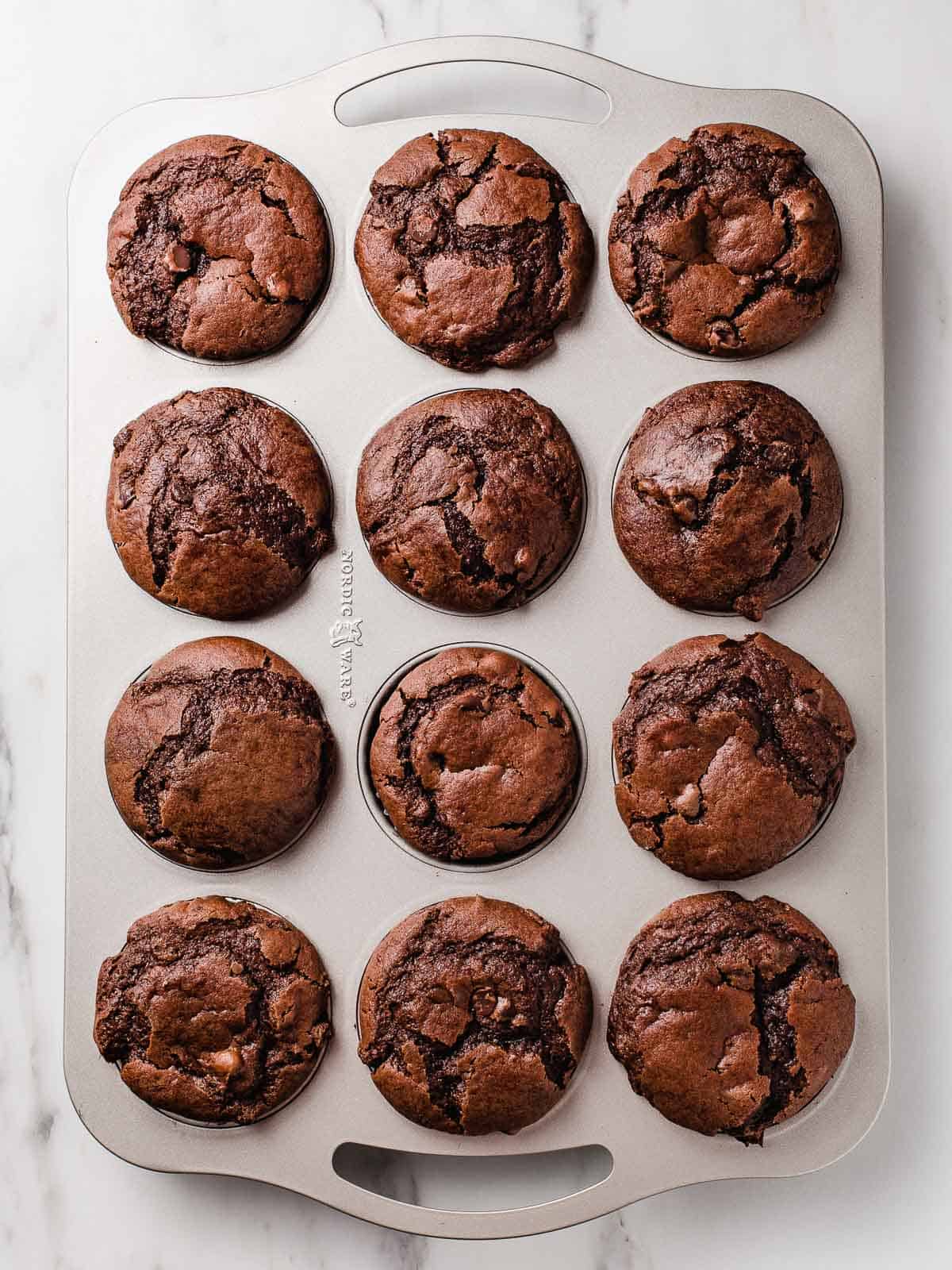 Twelve double chocolate sourdough muffins.