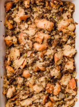 Sausage bread dressing in a baking dish.