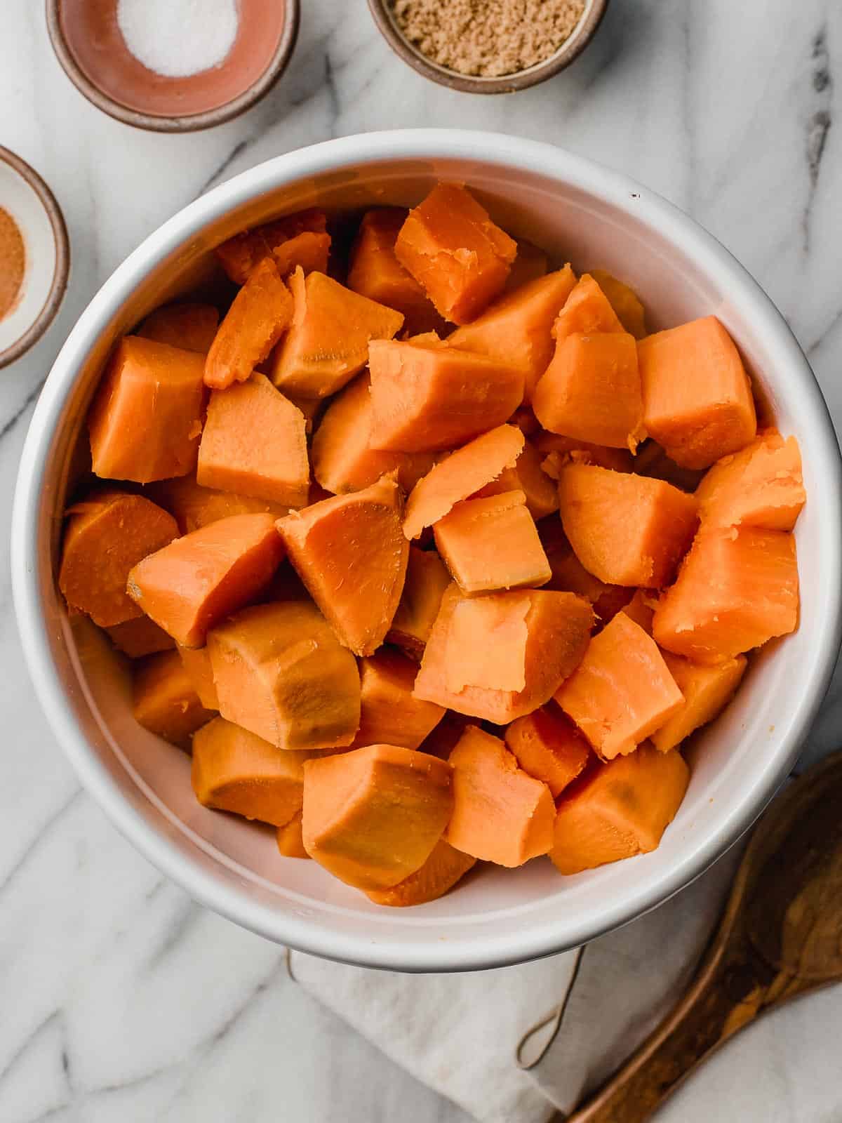 Sweet potatoes drained in a bowl.