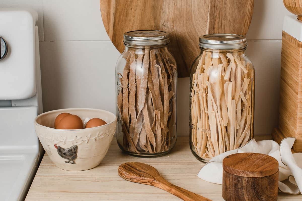 Dried sourdough pasta in glass jars.