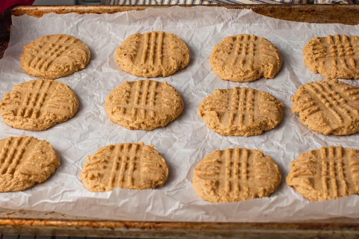 A sheet of baked sourdough peanut butter cookies.