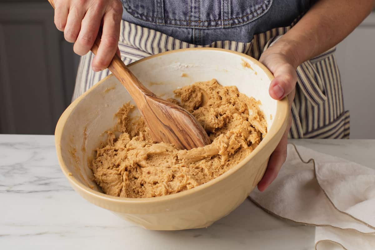 Sourdough peanut butter cookie batter in a bowl.