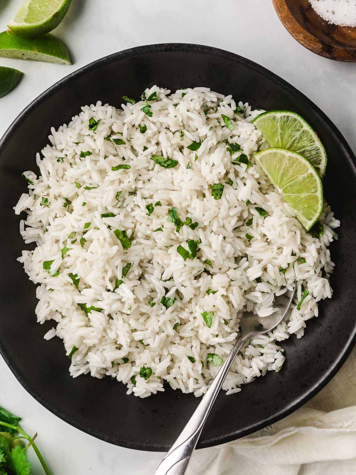 Cilantro lime rice in a bowl with a fork.