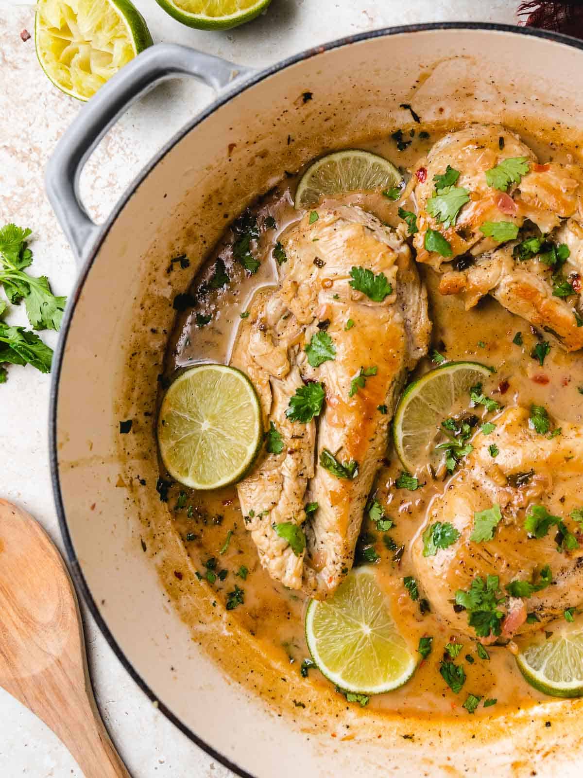 Coconut lime chicken with lime slices.