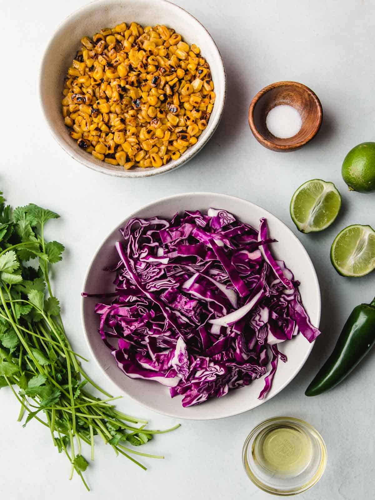 Corn and Red Cabbage Slaw ingredients on a table.