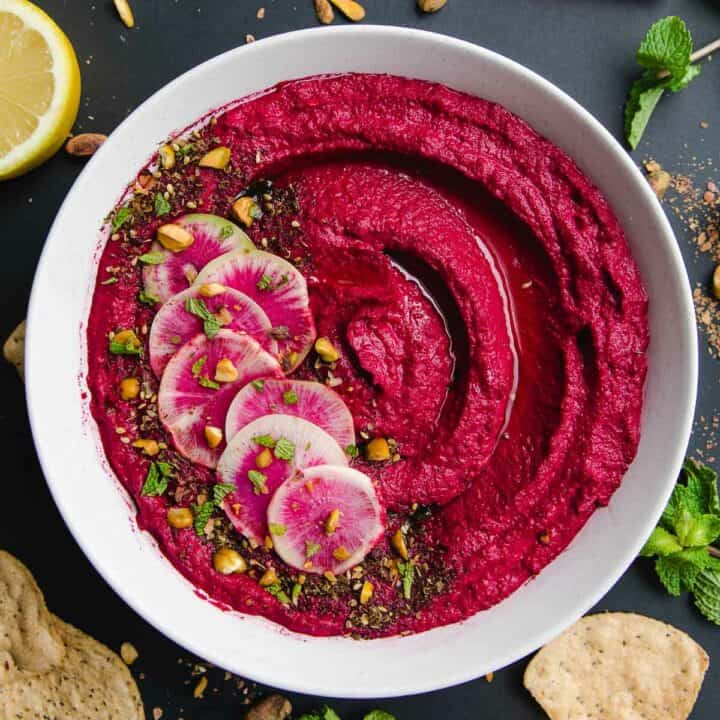 Roasted beet hummus in a bowl.