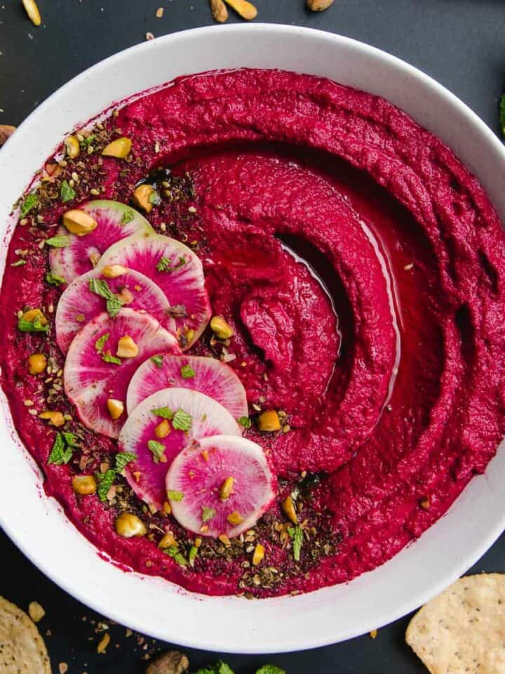 Roasted beet hummus in a bowl.