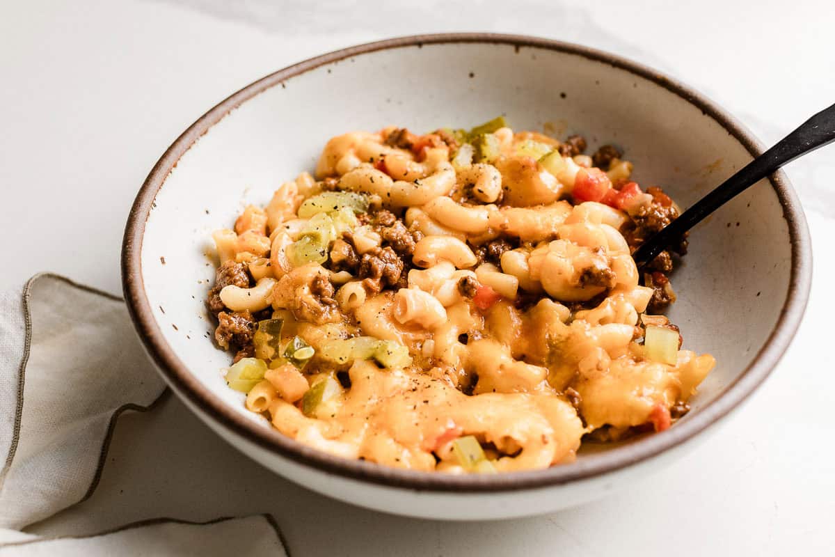 Cheeseburger  casserole in a bowl with a spoon.