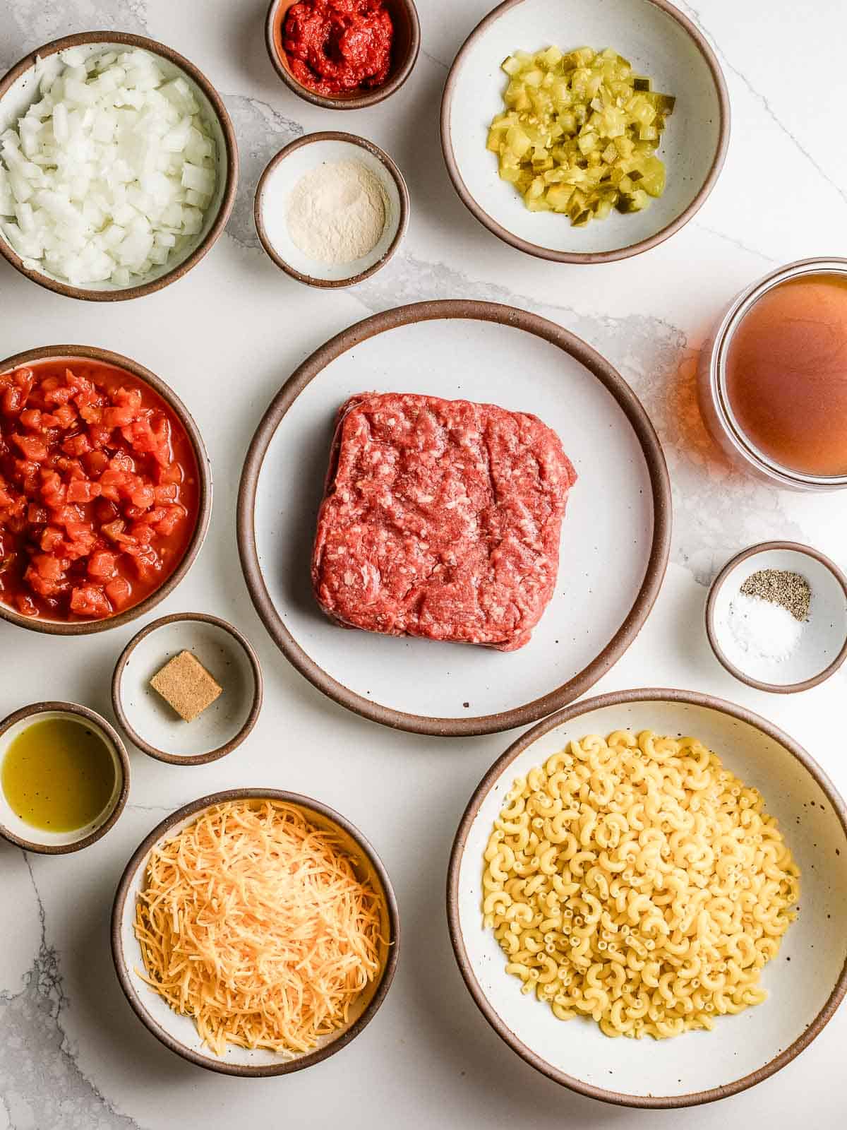 Cheeseburger  casserole ingredients on a table.