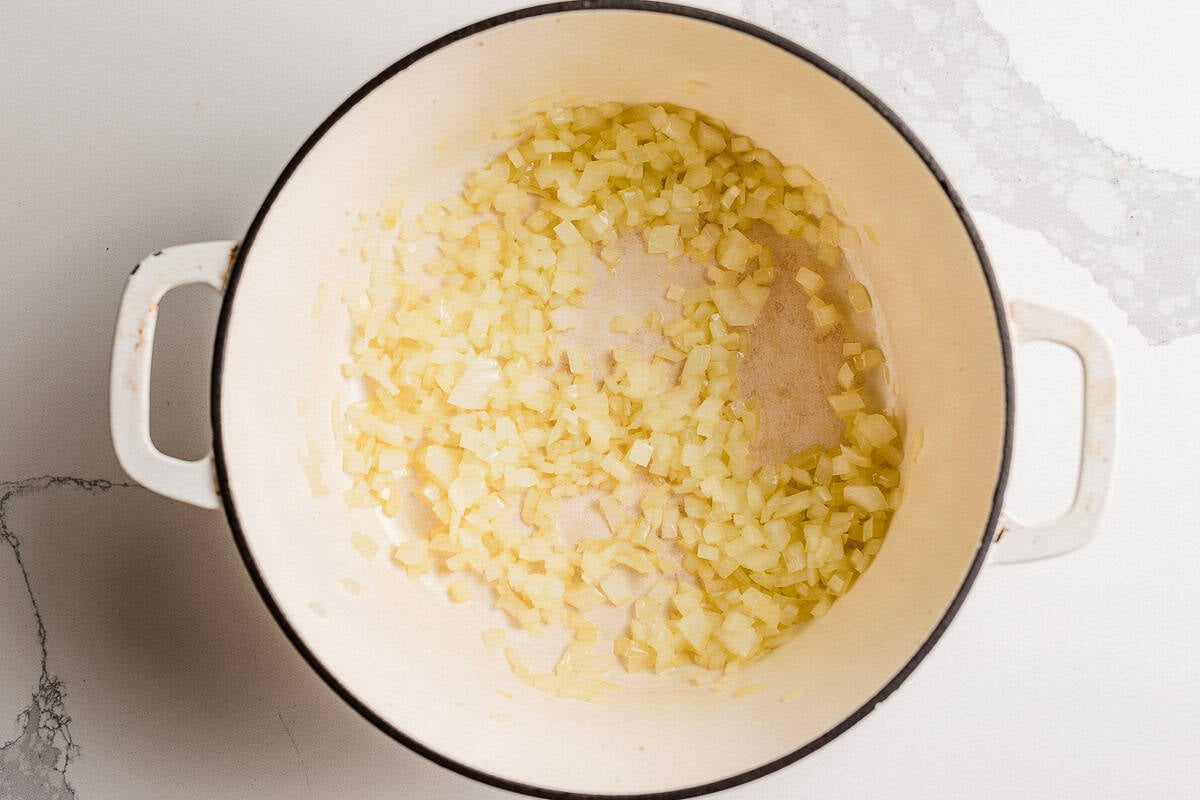 Onions cooking in a pot.