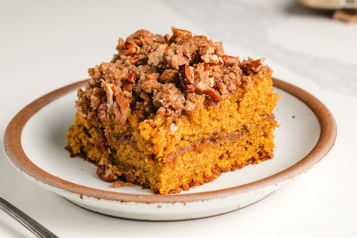 A slice of sourdough pumpkin coffee cake on a plate.
