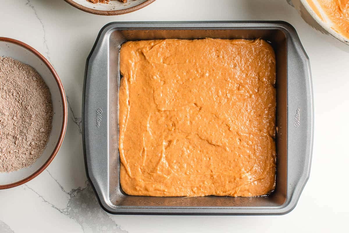 First layer sourdough pumpkin coffee cake batter in a dish.