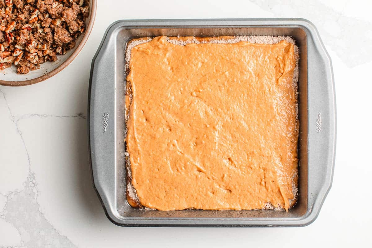 Third layer sourdough pumpkin coffee cake batter in a dish.