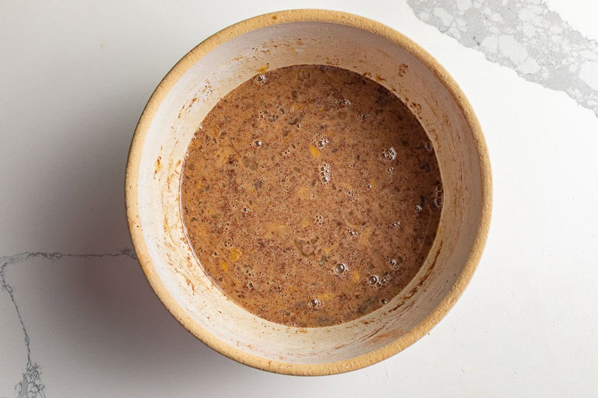 Wet ingredients for sourdough french toast casserole in abowl.