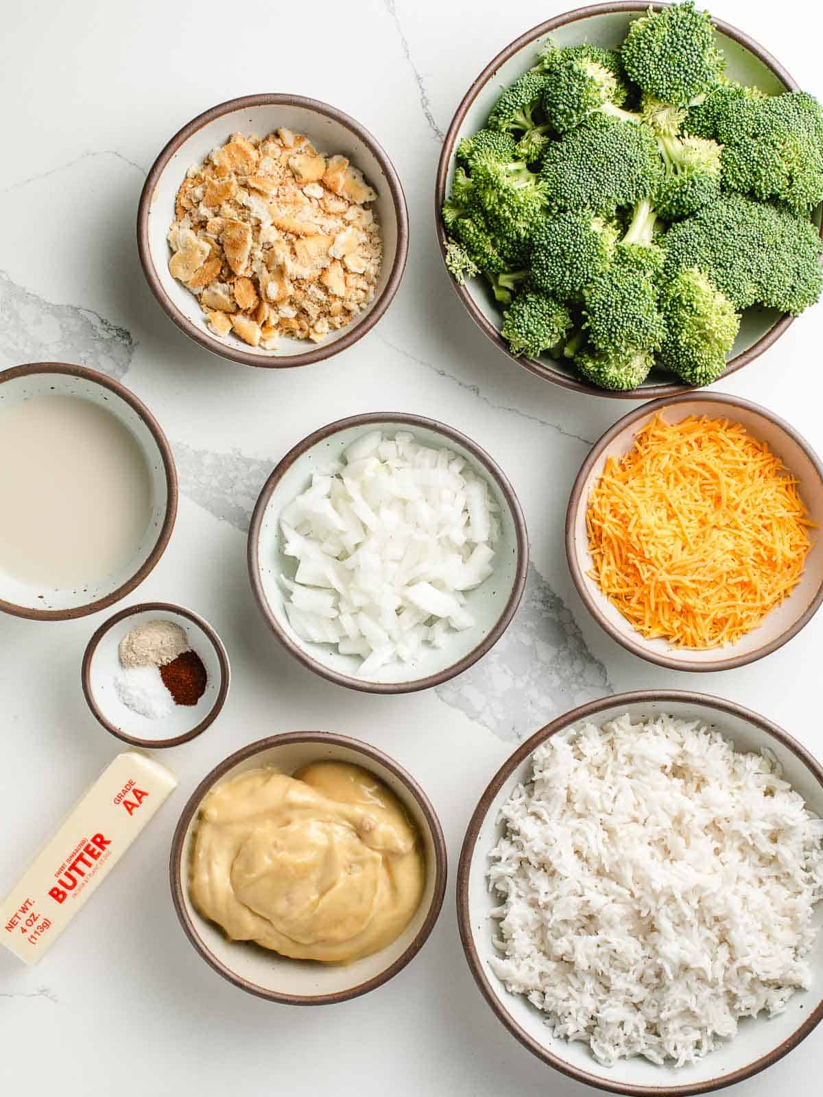 Ingredients for broccoli rice casserole on a table.