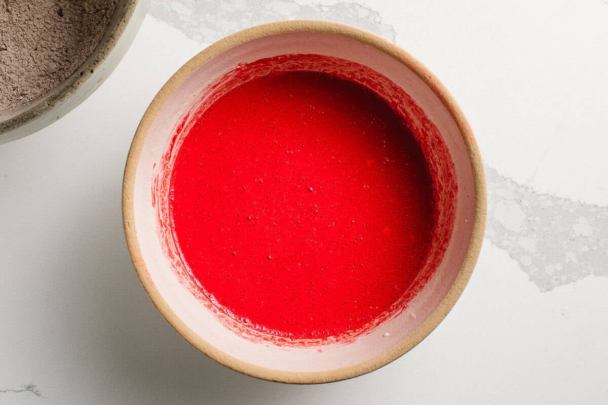 Wet ingredients for sourdough red velvet waffles in a bowl.