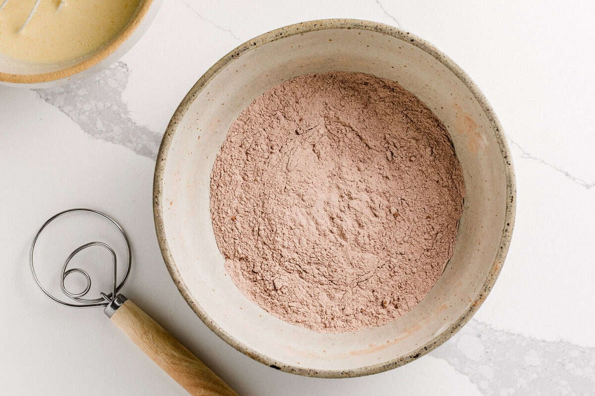 Dry ingredients in a bowl for chocolate sourdough waffles.