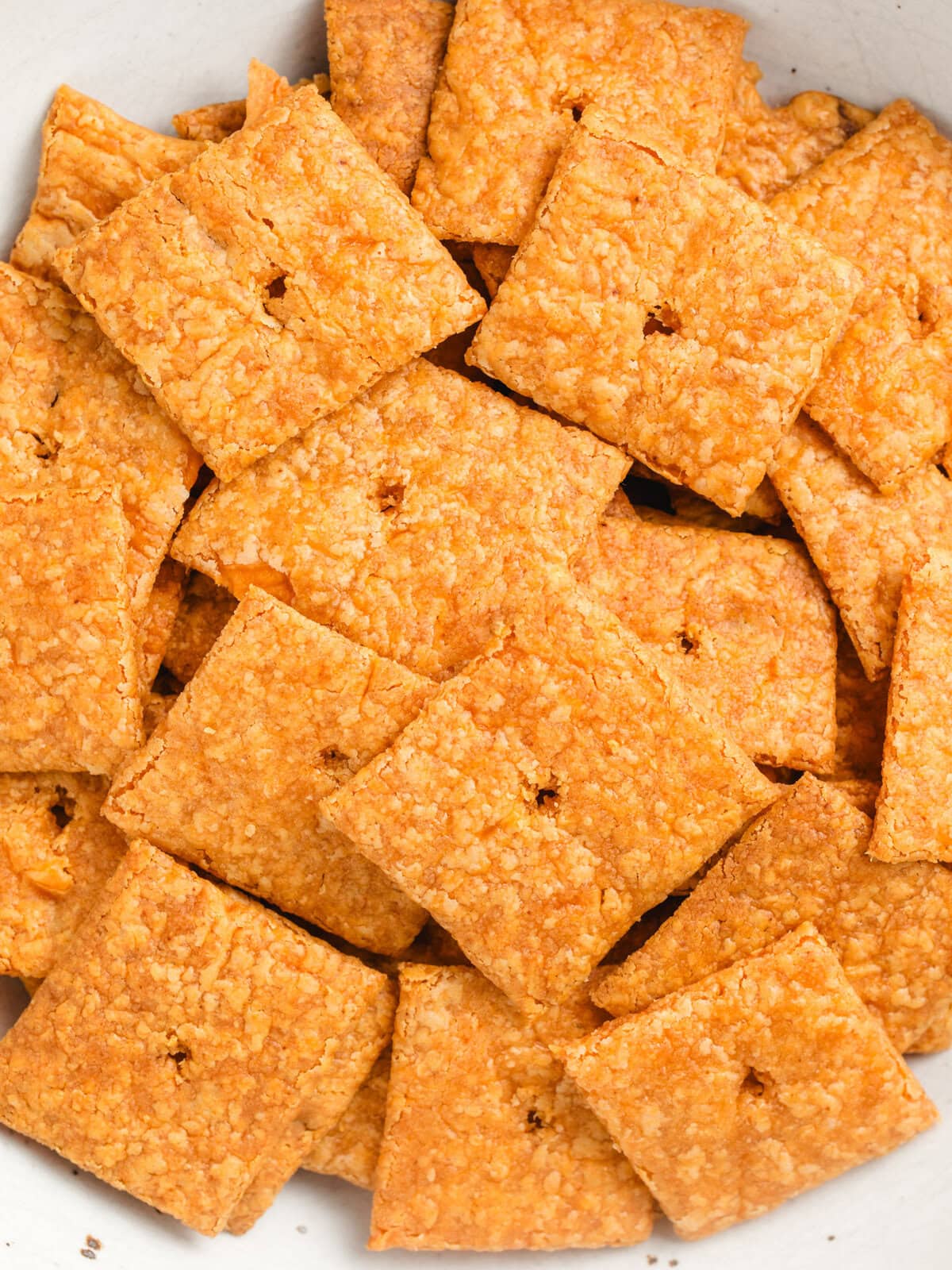 Close up of sourdough cheeze-its in a bowl.