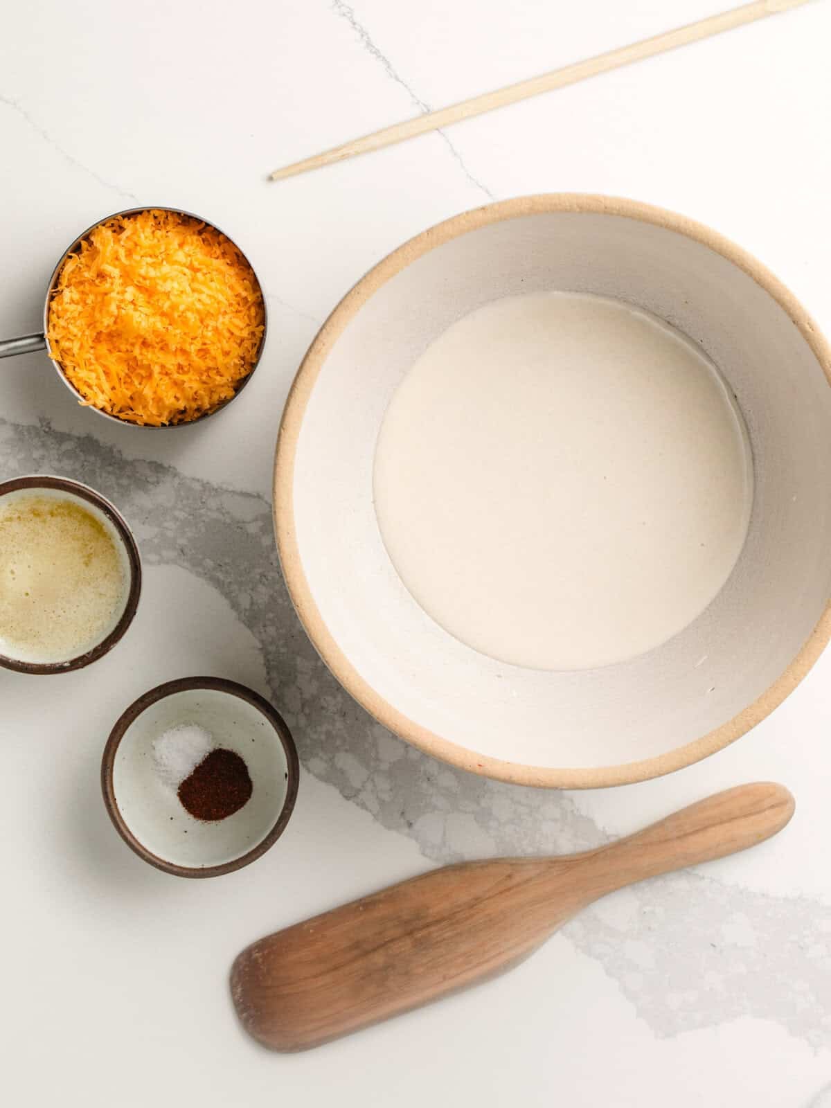 Ingredients for sourdough cheeze-its on a table.