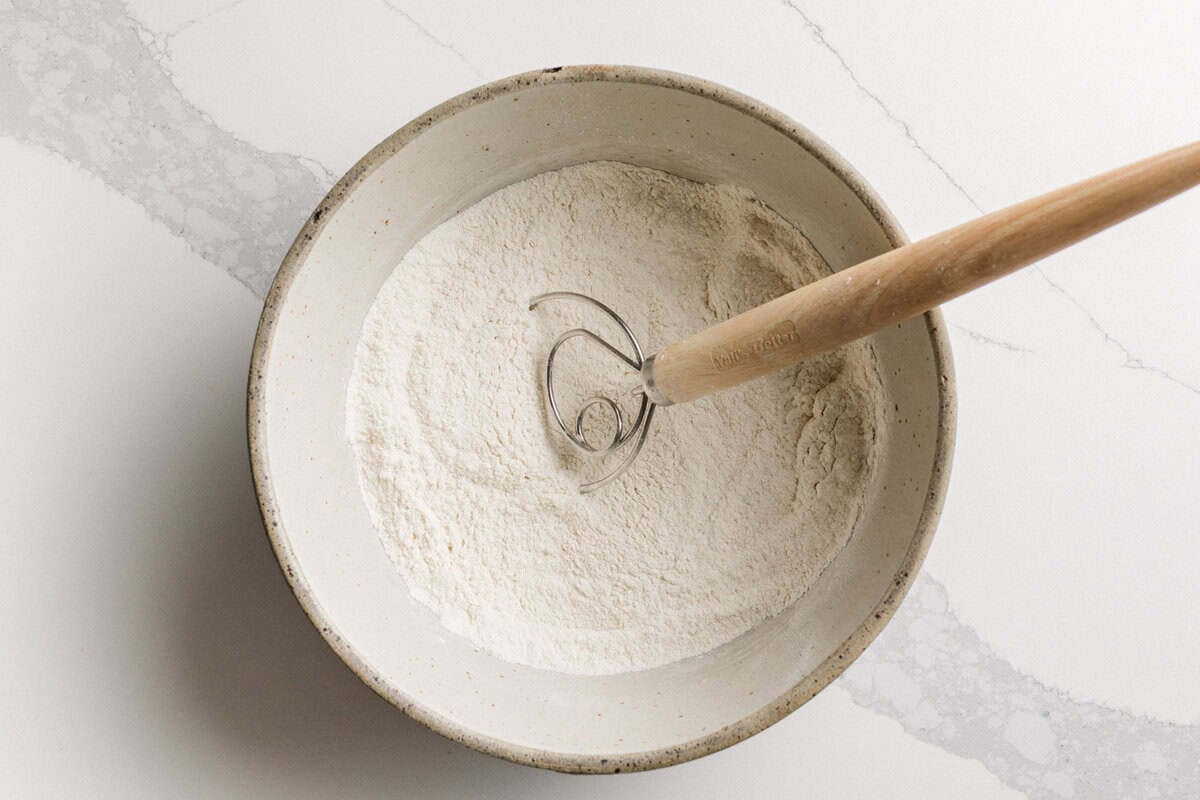 Dry ingredients for sourdough blueberry biscuits in a bowl.
