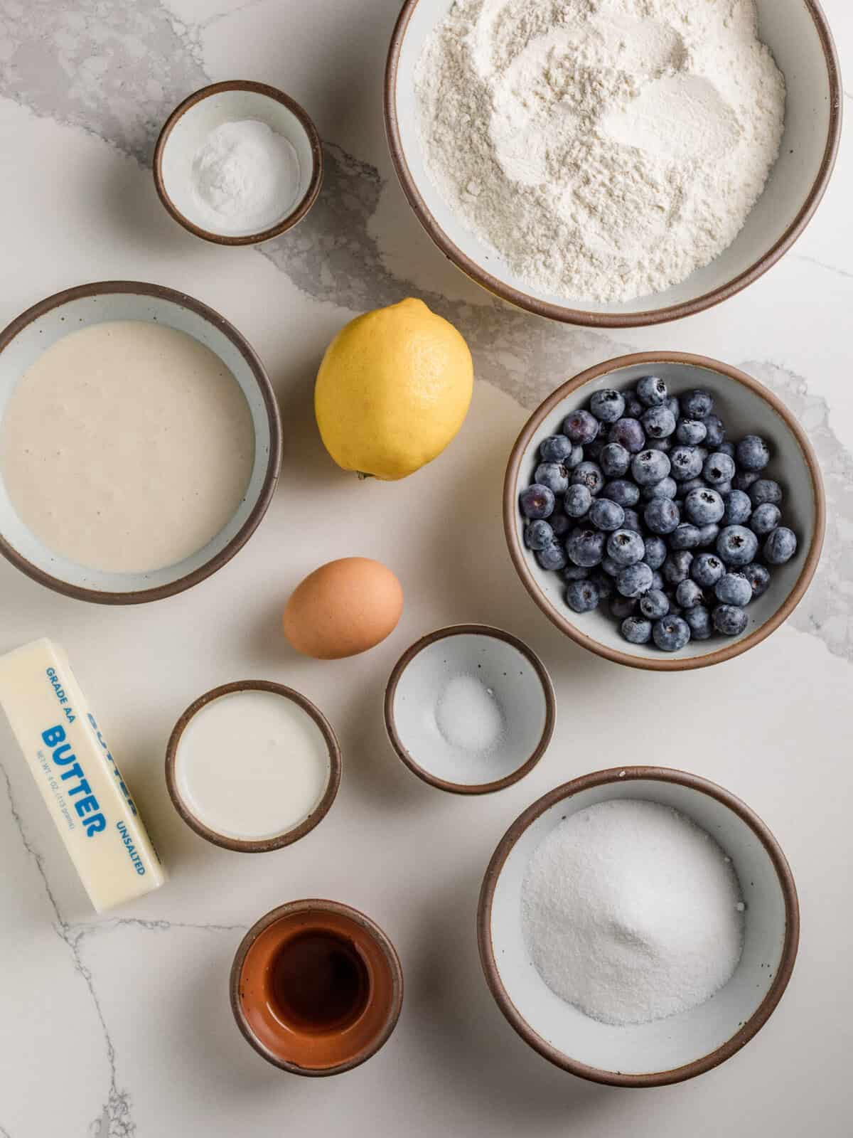 Ingredients for sourdough lemon blueberry scones on a table.