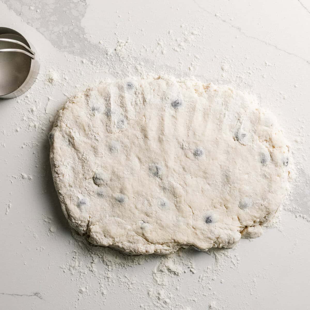 Sourdough Blueberry Biscuits dough on a counter.