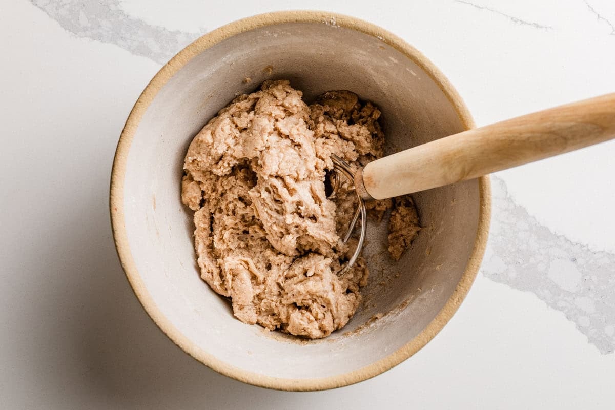 Sourdough cinnamon sugar crackers dough in a bowl.