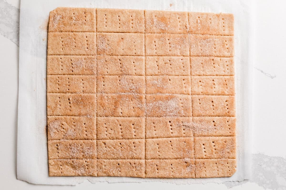 Sourdough cinnamon sugar crackers dough rolling out and cut.